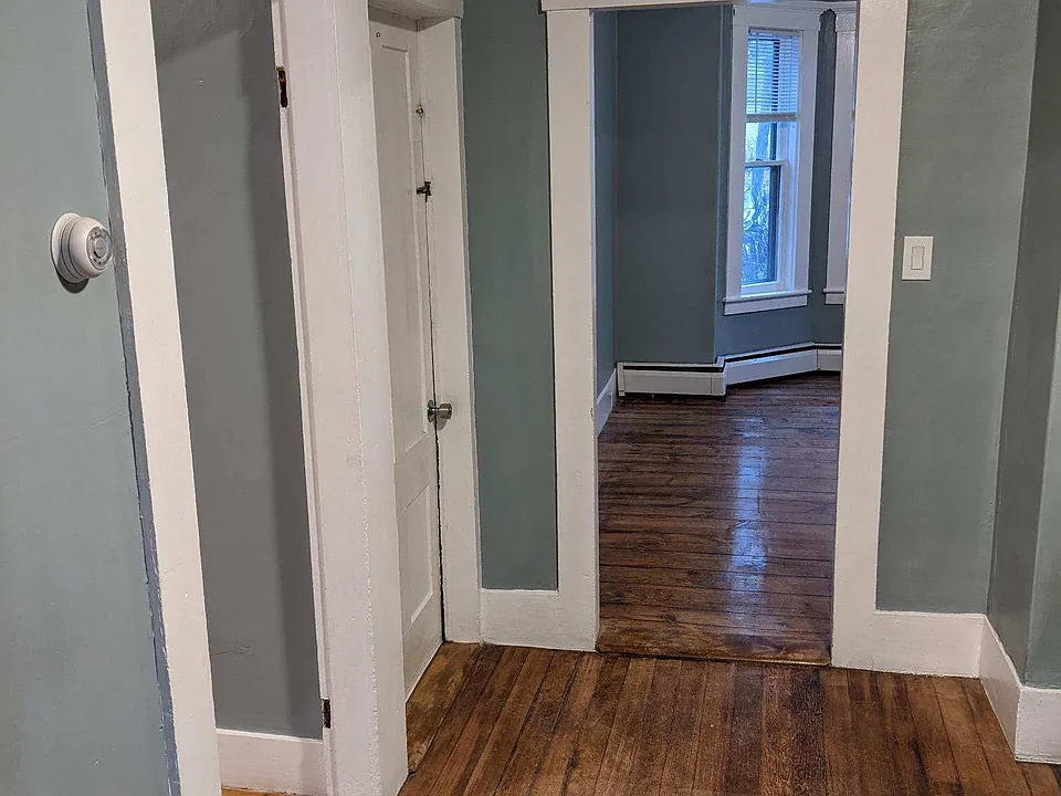 From the living room looking to entry of bedroom 1