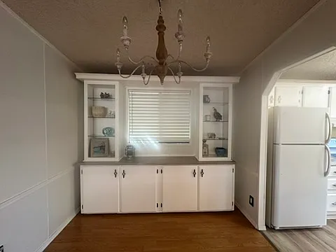 Dining room with built in storage cabinets. View from living room.