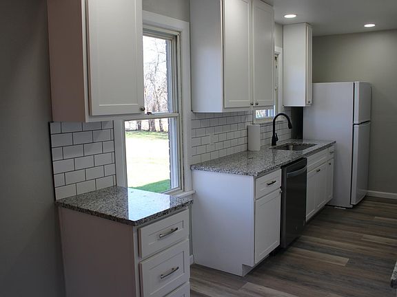 Kitchen has nice light, with two windows.