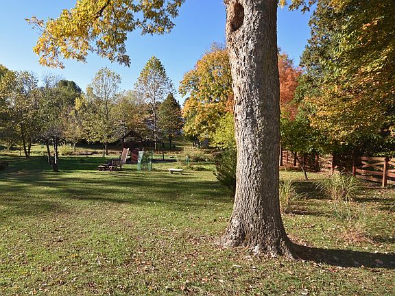 Over an acre private back yard view from the kitchen area.