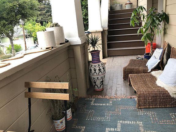 Porch for #1 and stairs to #2. #1 Outside storage room is accessible from porch, but not visible.