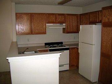 http://www.propertyboss.net/CustomerImages/AMMRE_1205/media/Properties/7817%20Louisiana%20(PO)\/zsmall_Kitchen.jpg