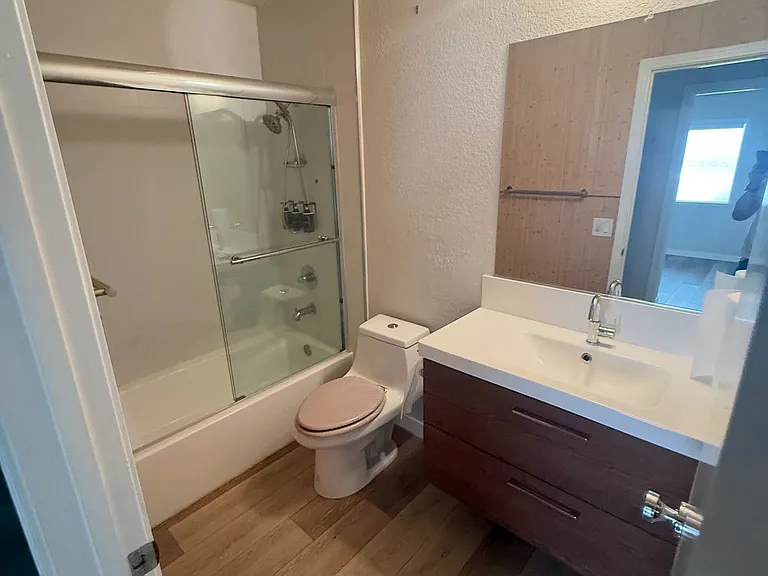 Bathroom with tub and shower