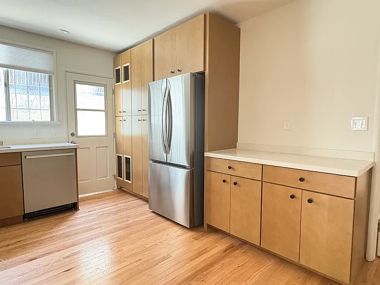 Kitchen with brand new stainless steel appliances, quartz countertops, and maple cabinets