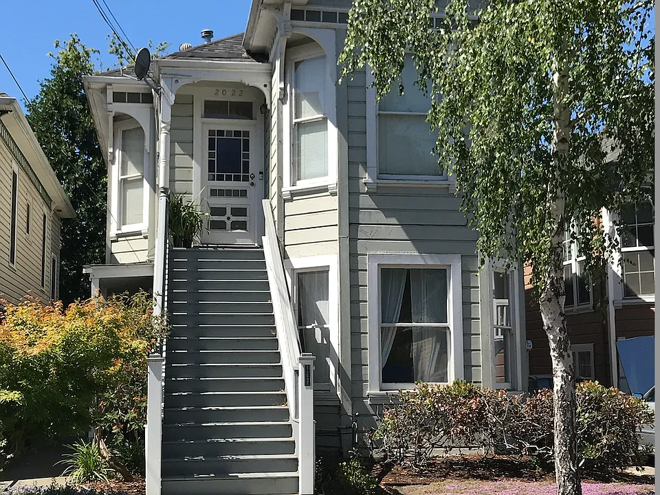 Front of the house. The downstairs entrance is along the left side of the house.