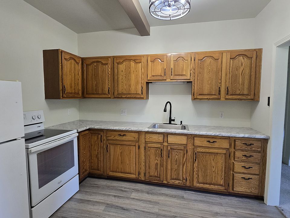 New kitchen counter tops, new light with fan built in. New glass top stove and refrigerator, new flooring.