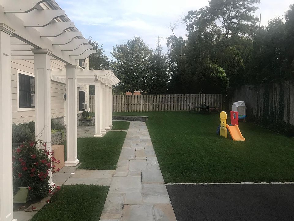 Blue stone patio outside unit.