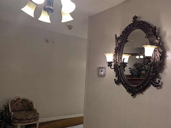 Foyer lighting with metal vintage mirror and side sconses
