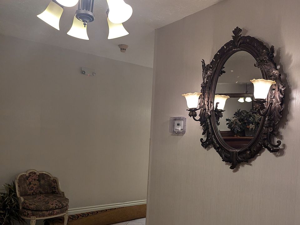 Foyer lighting with metal vintage mirror and side sconses