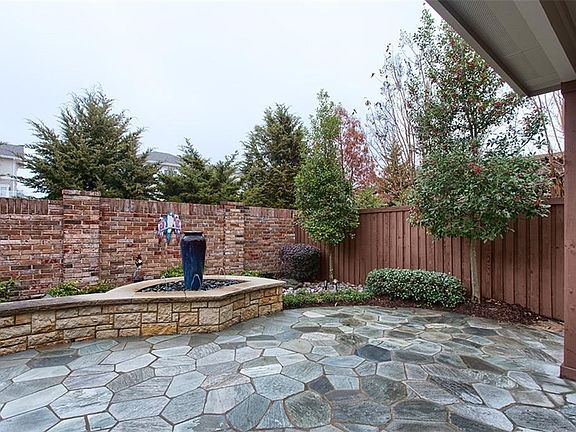 Beautiful expansive Flagstone patio with stunning water feature.  Quite and private!