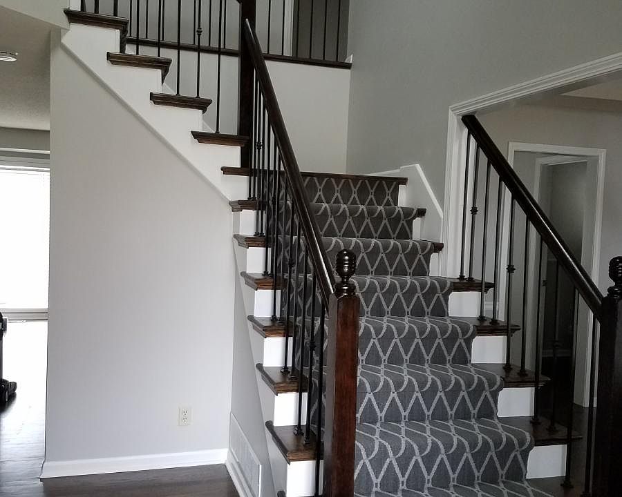 Entry staircase -- rot iron spindles