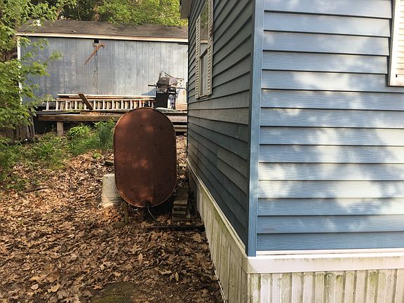 Back of home. Oil tank