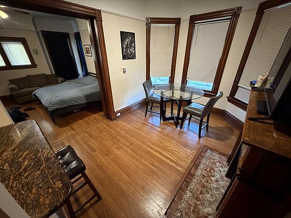 Living room with pocket doors open to bedroom