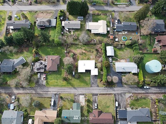 Gleaming white membrane roof, on a large lot.