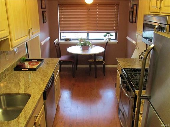 Updated eat in Kitchen with Granite counter tops, stainless steel appliances