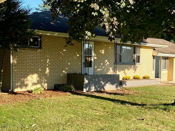 Cute front entrance with large planter boxes