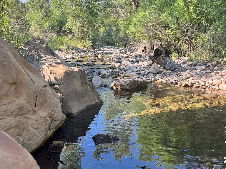 Junction creek running through front of shared property