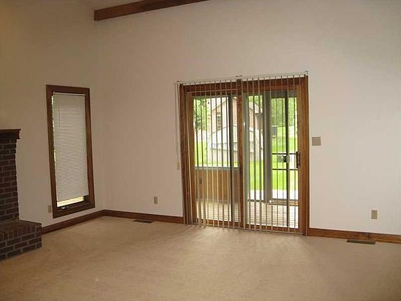 Great Room. Glass doors open to the enclosed porch
