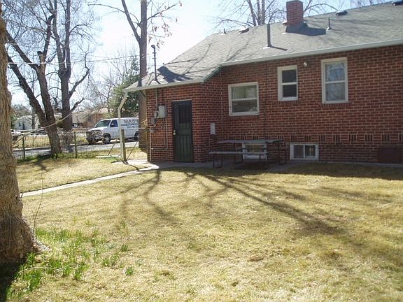 Large fenced back yard and garden area