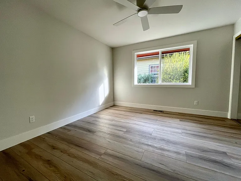 Unit 413 has refinished hardwood flooring rather than LVT like this unit 417