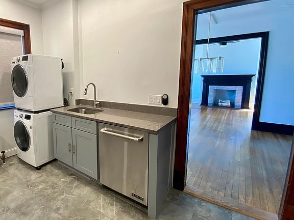 Kitchen / laundry units toward dining and living room