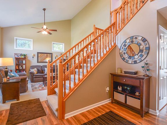 Entry Soaring ceilings greet you as you enter the foyer & living room