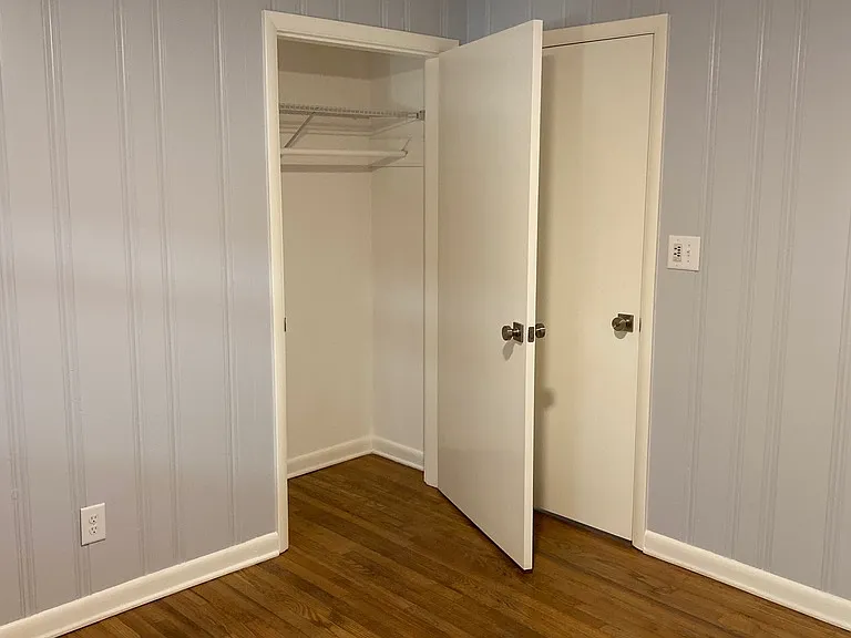 Bedroom off the hallway and closet.