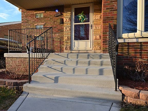 WELCOMING FRONT ENTRY - NEW SIDEWALK/PORCH AND RAILINGS IN 2016