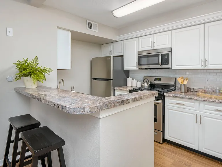 Whip up culinary masterpieces in our spacious kitchen, thoughtfully designed with a breakfast bar for cozy meals and plenty of storage for all your culinary needs.