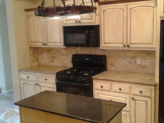 updated kitchen w/ side by side refrigerator and hi-efficien