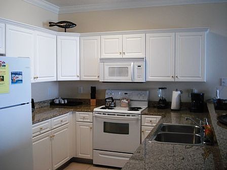 Kitchen with granit counter tops.
