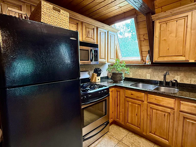 Kitchen has updated refrigerator, stove, microwave, and dishwasher