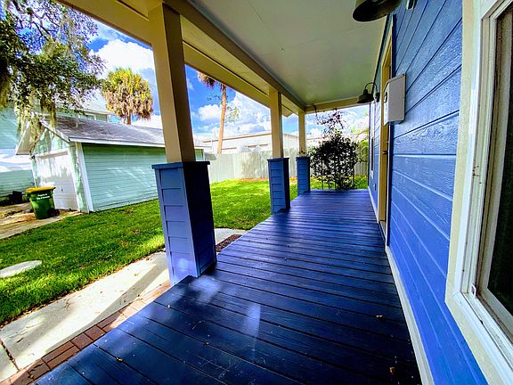 Cozy and spacious front porch is the perfect place for your morning coffee. Smell the night blooming jasmine in the yard