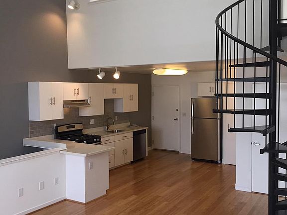 Living/kitchen and upstairs loft bedroom