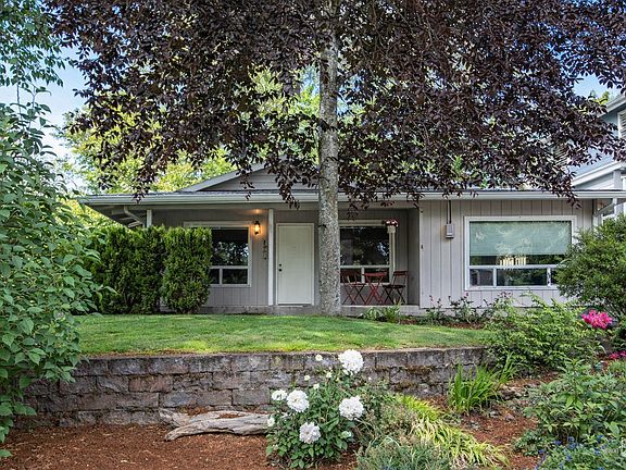 View of house from street. House sits well above street, so front porch and yard are great places to hang out and watch pedestrians go by.