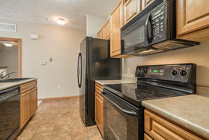 Sleek appliances and plenty of cabinet storage adorn our kitchens.