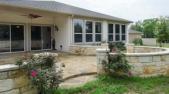 Added stone back patio plus waterfall.