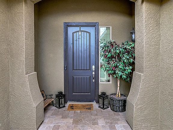 Brick paved welcoming covered entrance