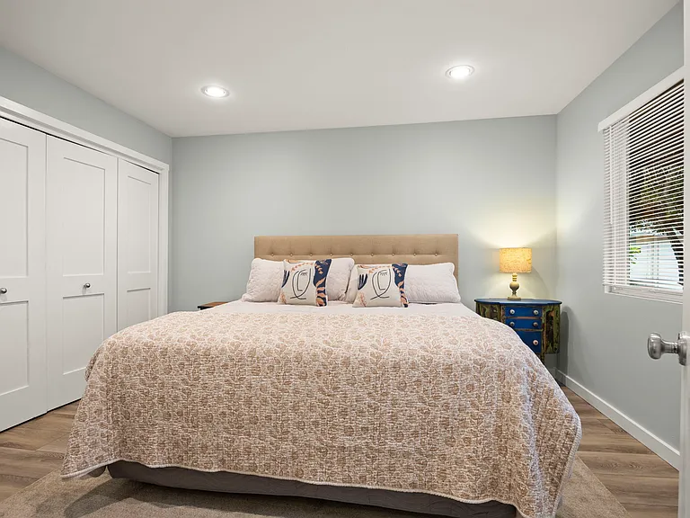 3rd bedroom off hallway with king sized bed.