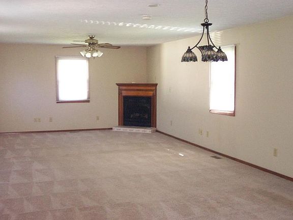 31 X 14 Family Room with corner gas log fireplace and separate entry.