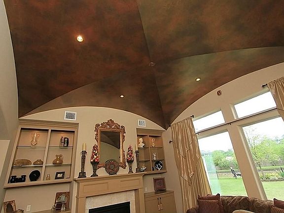 The dramatic groin vaulted ceiling is astounding! The designer's choices of ceiling treatments throughout the home are uniquely sophisticated.