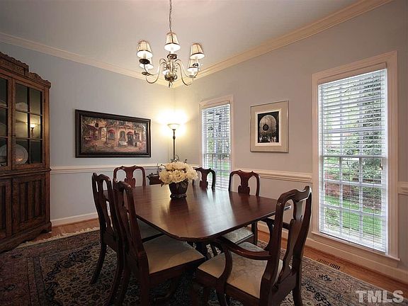 Entertain in style with this lovely formal dining room. Hardwood floor.  Chair rail. Crown molding. Two windows bring in lots of natural light.