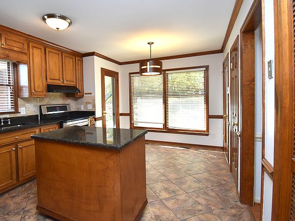 A view of the kitchen overlooking the eat-in and back yard.
