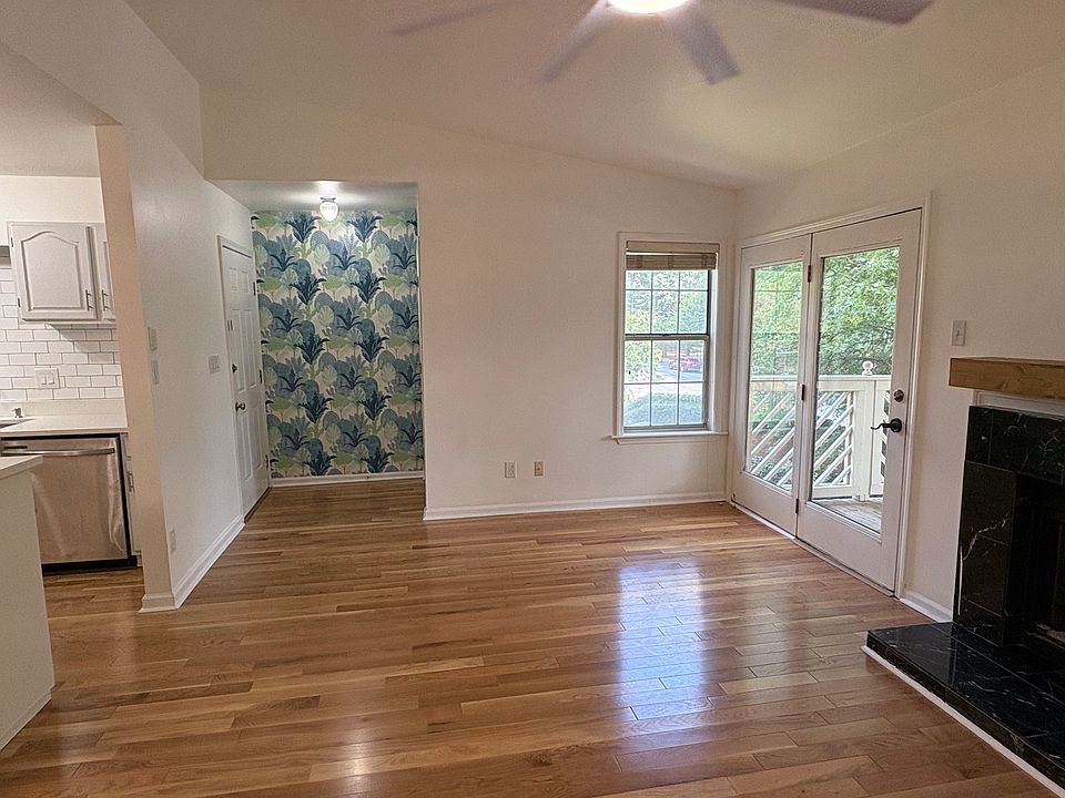 Living area looking at entry to condo