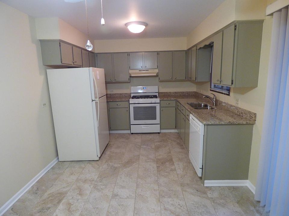 New granite countertops, floor tile, stove, refrigerator!