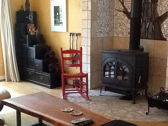 Living room has bamboo floors and 55" tv, sofa, desk, extra chairs. Google internet. Some streaming is furnished.