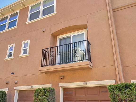 Here's your own sliding patio door that opens from the living area out to your terrace with a wrought iron railing.