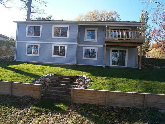 Back of home with deck