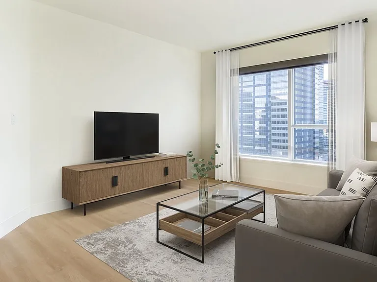 Renovated Package I living room with hard surface flooring