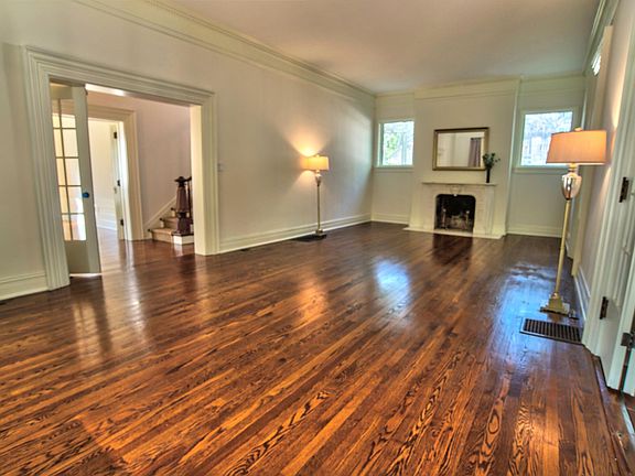 Spacious living room with real wood fireplace